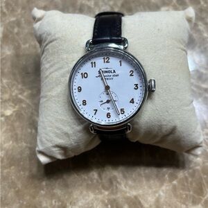 Shinola Agonite-1069 with sub-second dial.  Silver Case w/ gold numerals.